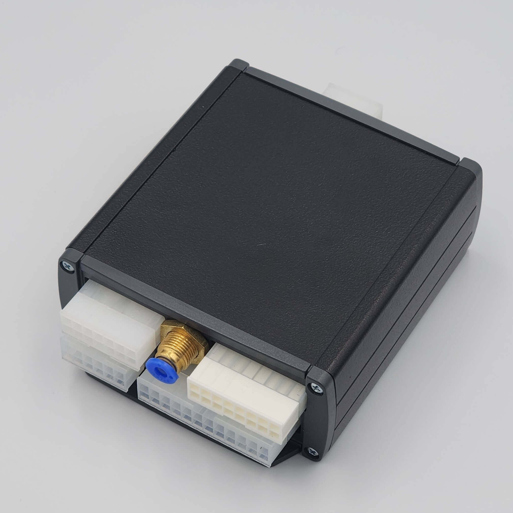 Black rectangular device with brass fitting (Diff Lock Anytime).