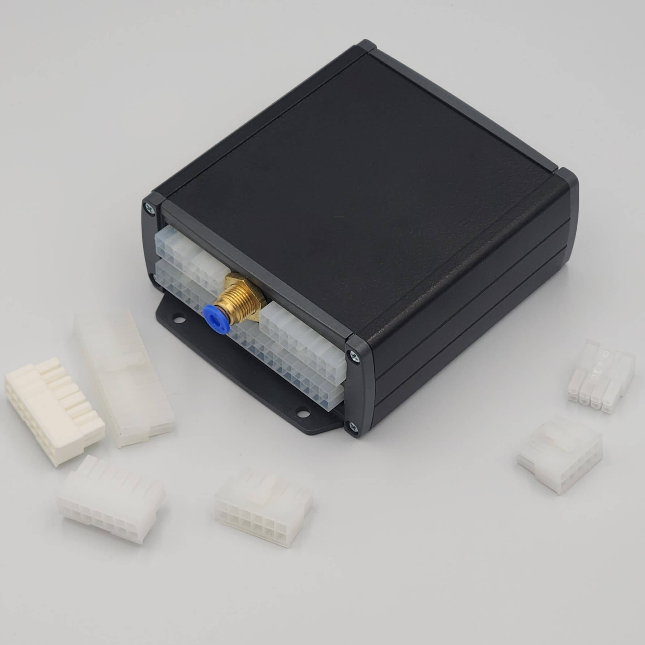 Black device with blue air fitting, four white connectors.