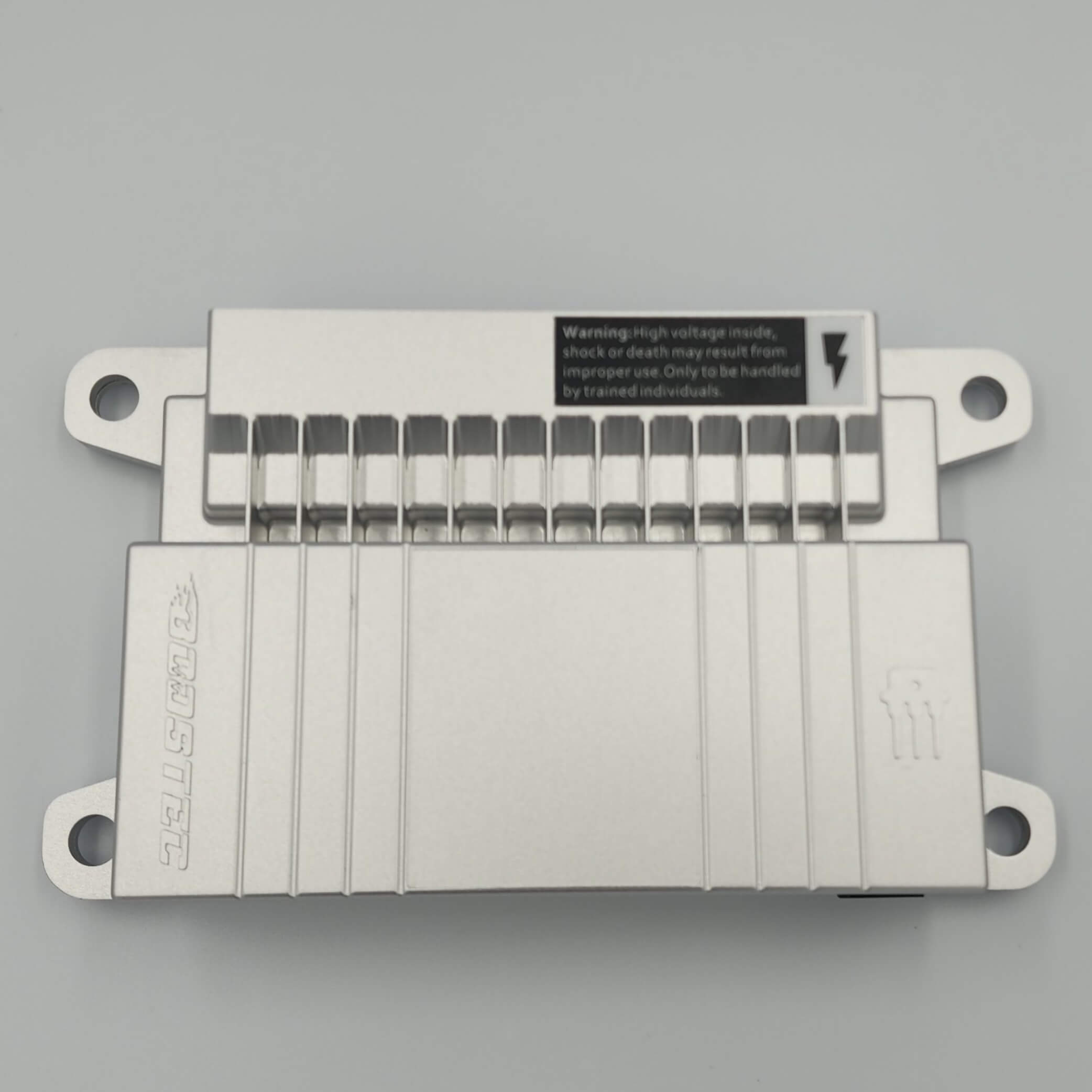 Metal electrical device with high voltage warning and top terminals.