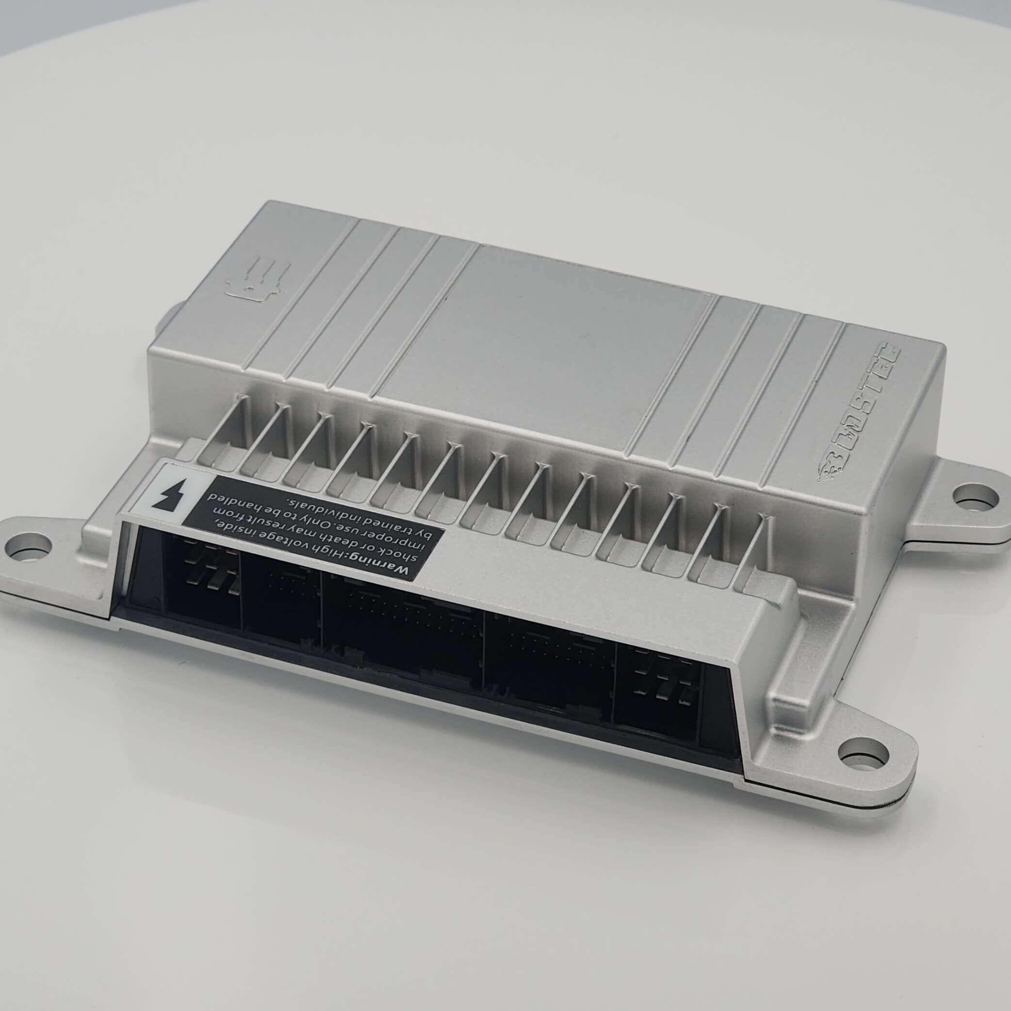 Silver electronic module with heat sinks, connectors, and labels.