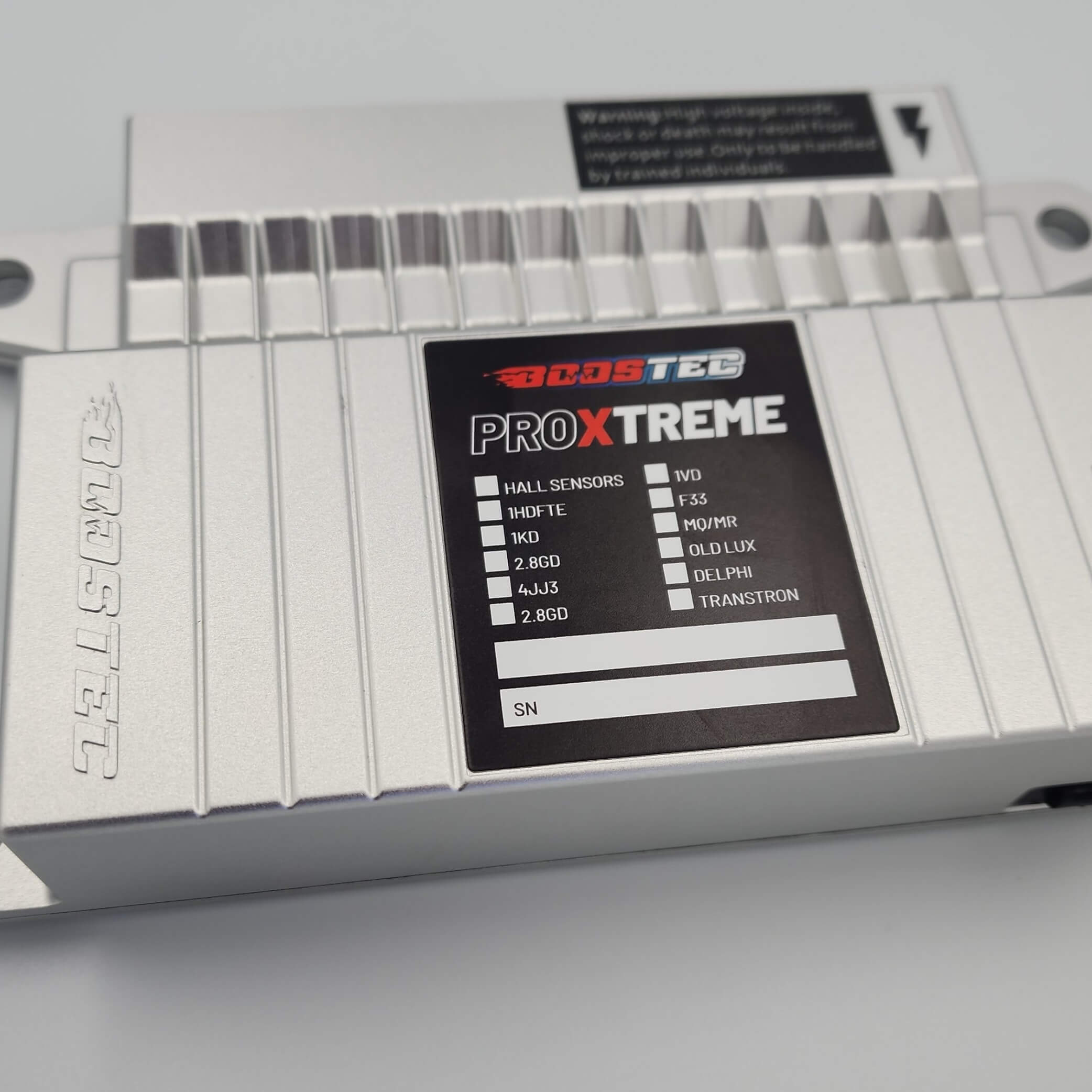 Close-up of Boostec ProXtreme ECU with specs label and ridged case.