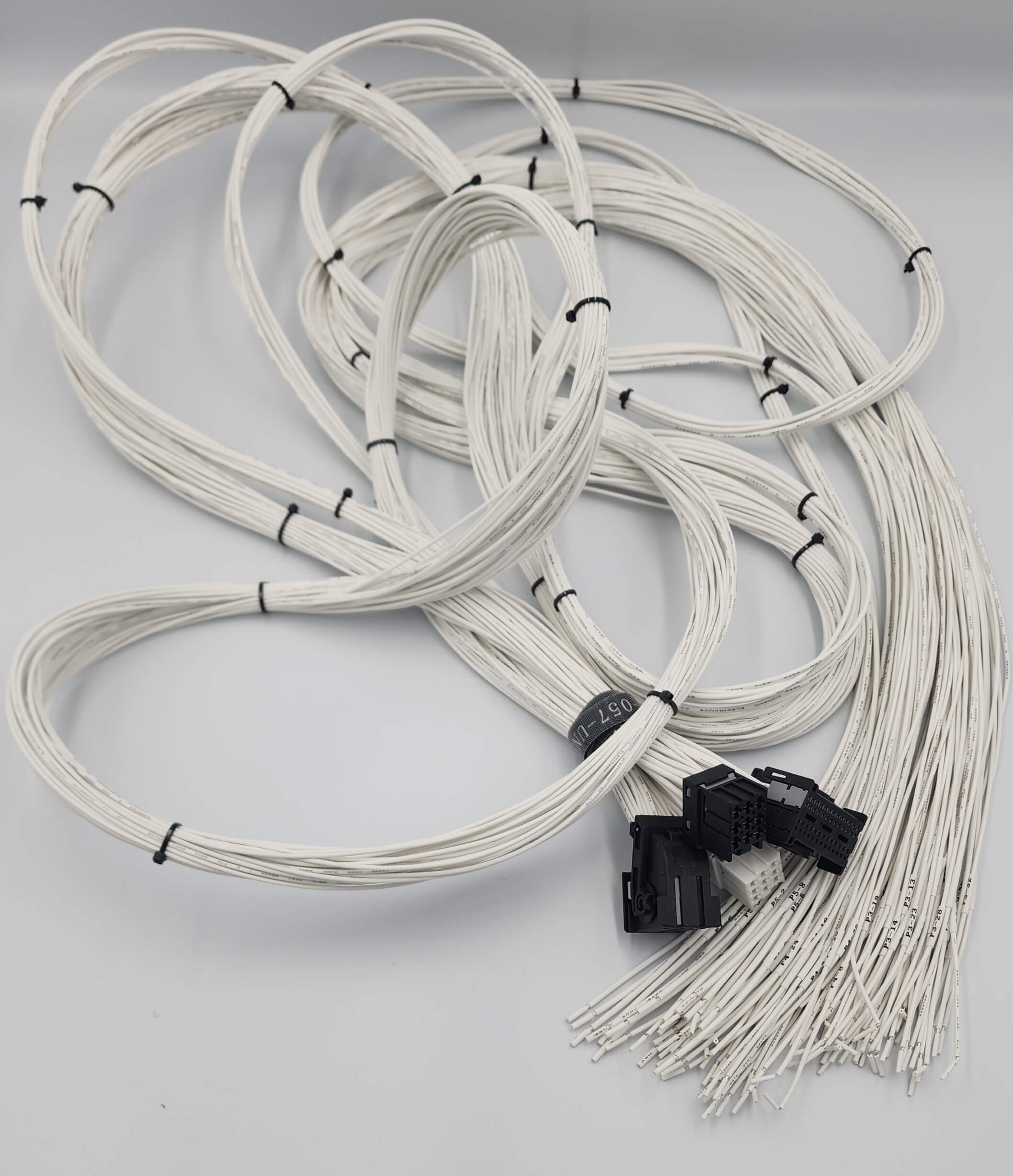 Boostec ProXtreme cable bundle with connectors and labels on gray.