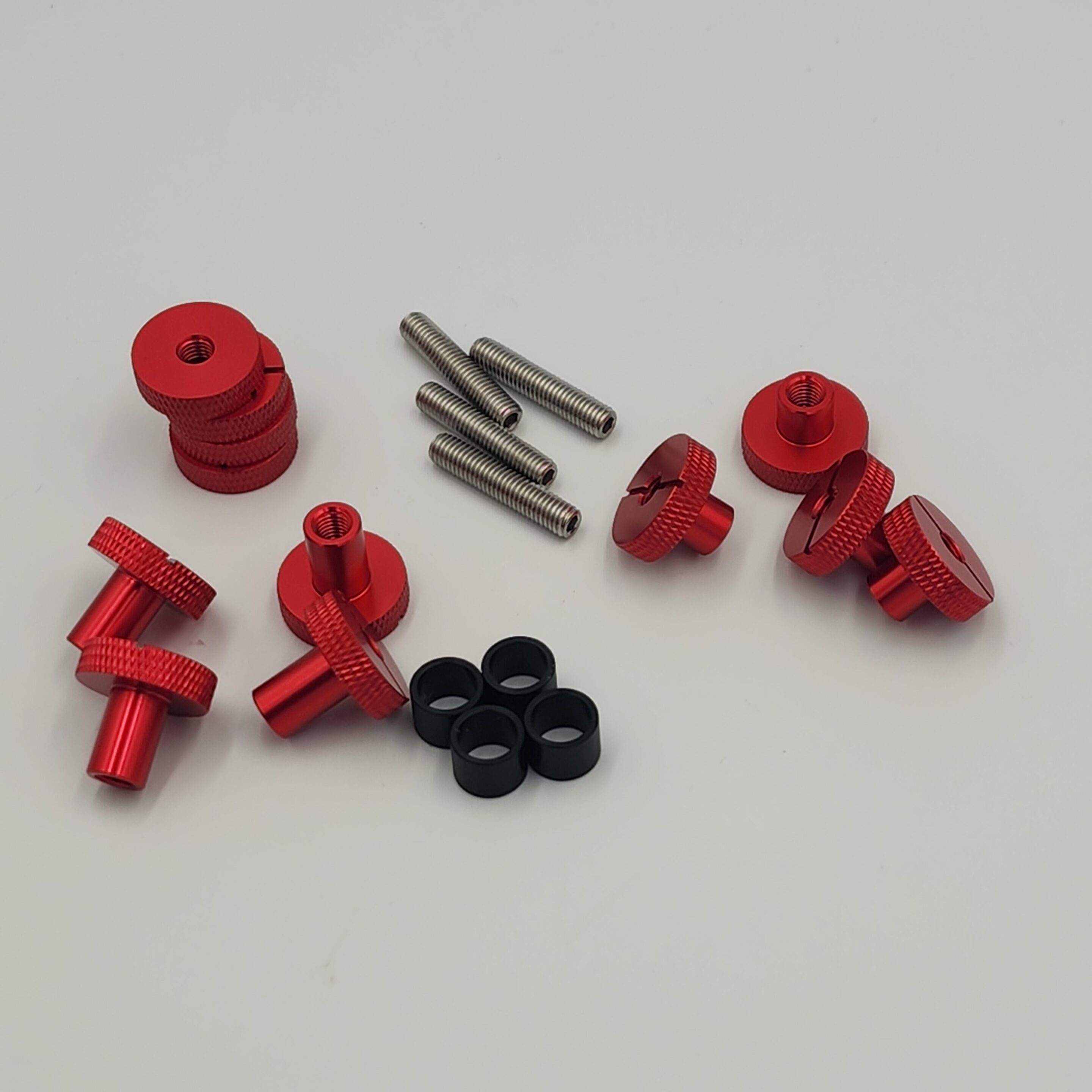20240528_122722 Red thumb screws, metal bolts, and black washers set.