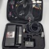 Electronics kit with cables in a carrying case.