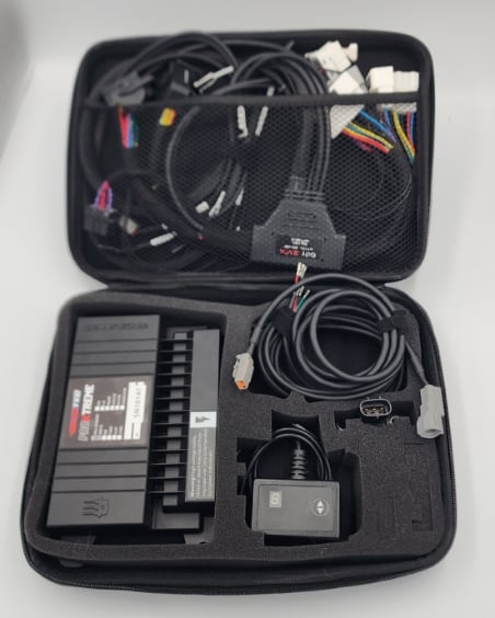 Electronics kit with cables in a carrying case.
