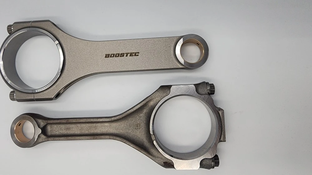 Two metallic rods: 'BOOSTEC' polished and Tundra 700hp+ matte.
