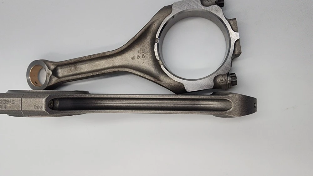 Close-up of two Tundra 700hp+ Billet Rods showing bolt holes.